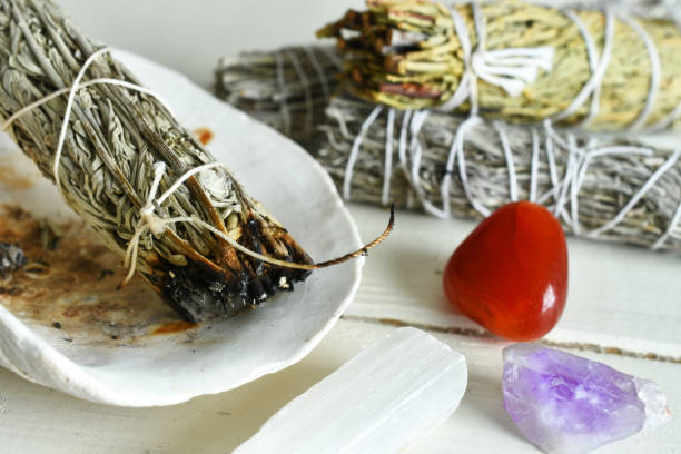istock Burning White Sage Smudge Stick and Carnelian Crystal 1310031263