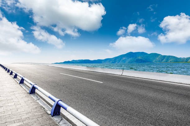 istock Asphalt highway and mountain with river natural landscape. 1310032377