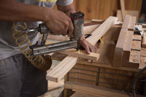 istock Closeup of a man carpenter using a nail gun. 1310032587