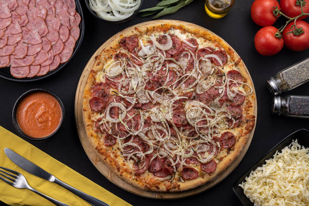 Pepperoni sausage pizza, mozzarella cheese, onion and tomato sauce