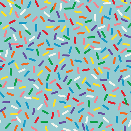 A bright, simple and sweet rainbow candy sprinkles seamless pattern.