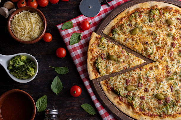 istock Brocolis pizza with bacon, tomato sauce and mozzarella cheese 1310034171