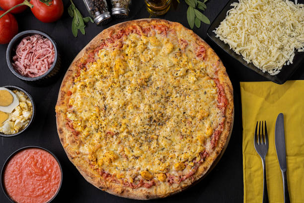 istock Pizza with mozzarella cheese, ham, egg and tomato sauce 1310034326