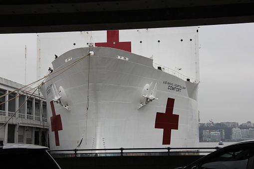Hospital ship USNS COMFORT docked at Pier 90, upon arrival to NYC, partial view, Manhattan West Side, New York, NY, USA - March 30, 2020