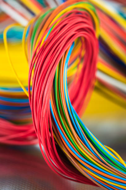 istock Colorful electrical and telecommunication cable wire on shiny metal surface 1310037572