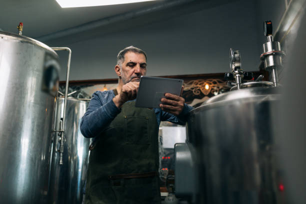 istock man working in mini craft beer brewery 1310041265