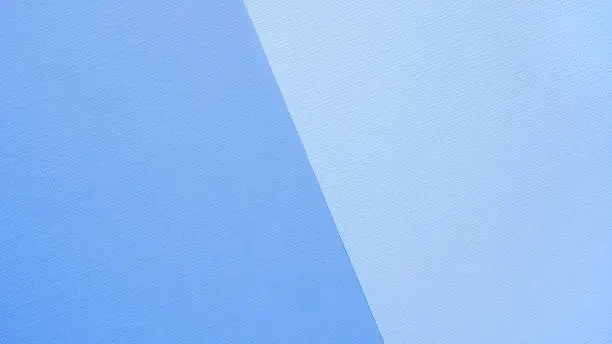 Two-color paper background, the color background is divided obliquely into two colors - in blue and blue color scheme. Blank for the designer, template