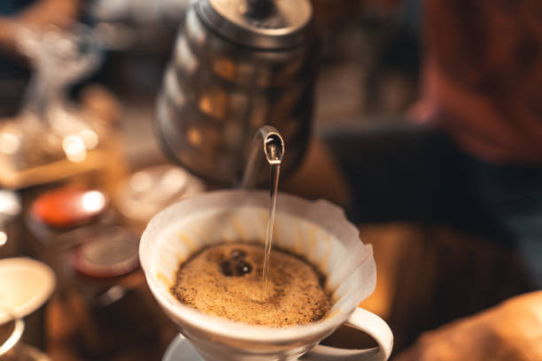 istock Drip coffee hot water from the kettle into the coffee. 1310041428