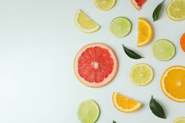 istock Fresh citrus slices on white background, space for text 1310044447