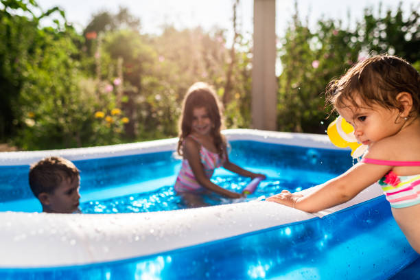 istock Children games in swimming pool 1310044504