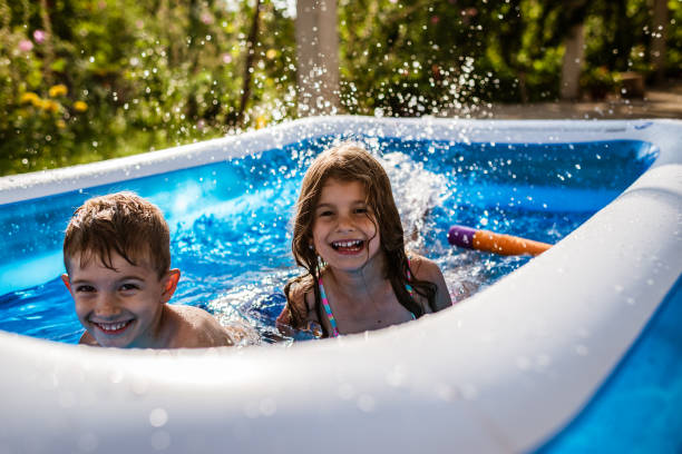 istock Children games in swimming pool 1310044583
