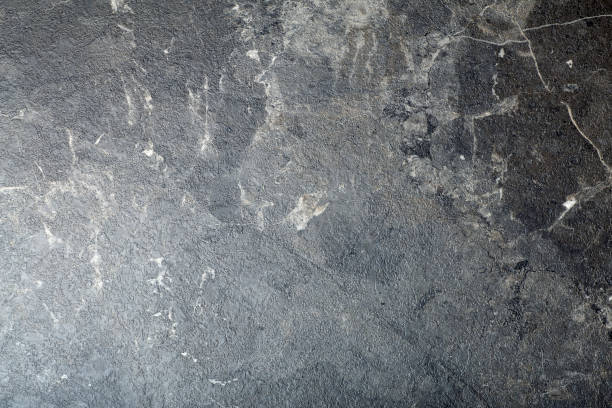 istock Black marble background. Background with texture and pattern of black stone, marble or granite. 1310045164