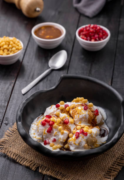 istock Super soft  Dahi Bhalla or Dahi Vada served in a black bowl 1310045506