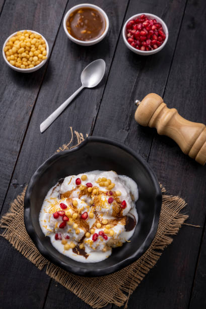 istock Super soft  Dahi Bhalla or Dahi Vada served in a black bowl 1310045545