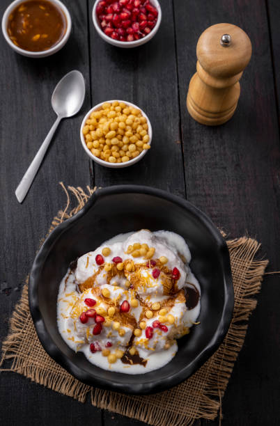 istock Super soft  Dahi Bhalla or Dahi Vada served in a black bowl 1310045603