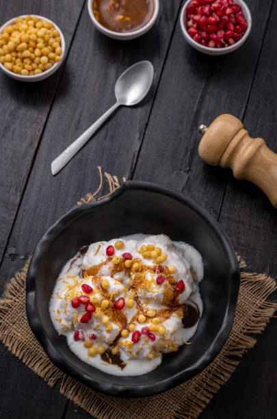 istock Super soft  Dahi Bhalla or Dahi Vada served in a black bowl 1310045644