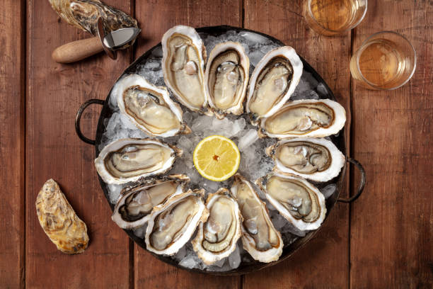 istock Oysters, overhead flat lay shot with lemon and wine 1310046227