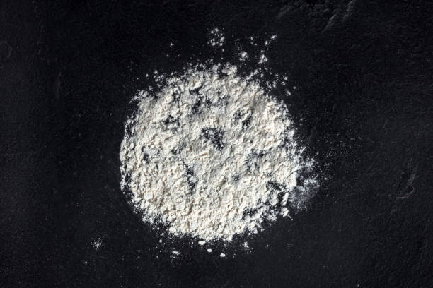 istock White flour on a black background, an abstact culinary design template 1310046255