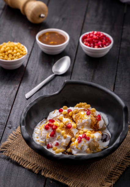 istock Super soft  Dahi Bhalla or Dahi Vada served in a black bowl 1310046329