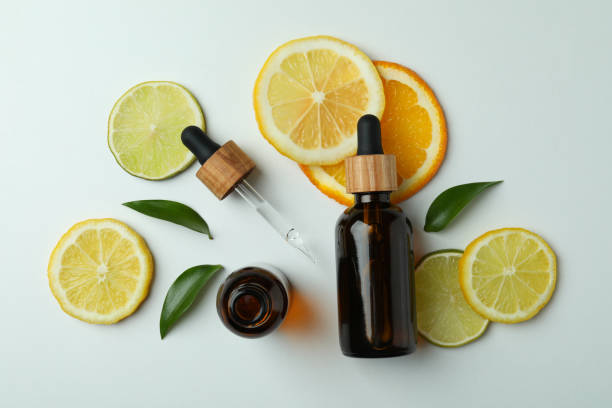 istock Dropper bottles with oil and citrus slices on white background 1310046330