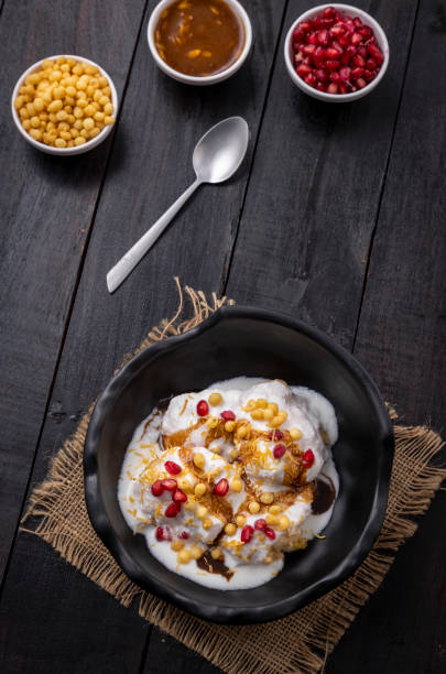 istock Super soft  Dahi Bhalla or Dahi Vada served in a black bowl 1310046388