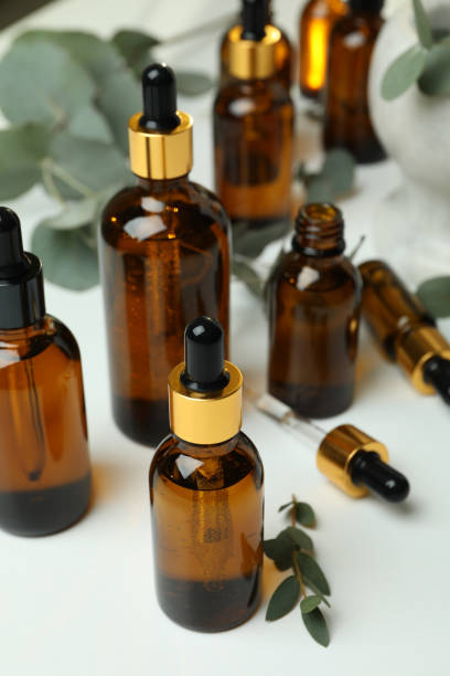 istock Concept of natural cosmetics with eucalyptus oil on white table 1310046908