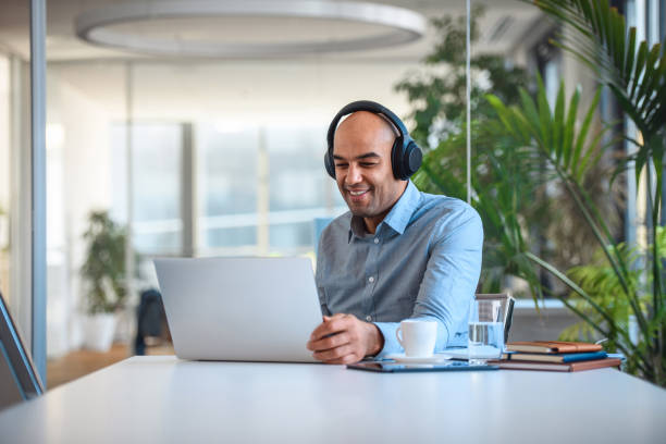 istock Smiling Mixed Race Male in Mid 40's Educating Online 1310046997