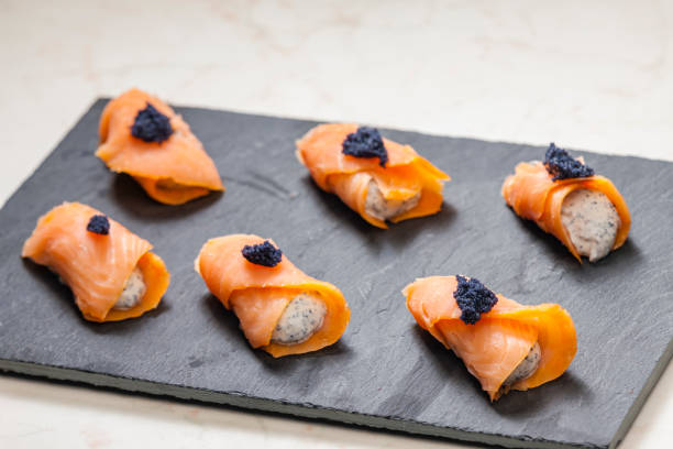 istock smoked salmon rolls filled with cream cheese and black caviar 1310047693