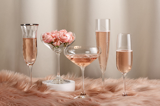 Arrangement of different glasses with rose wine