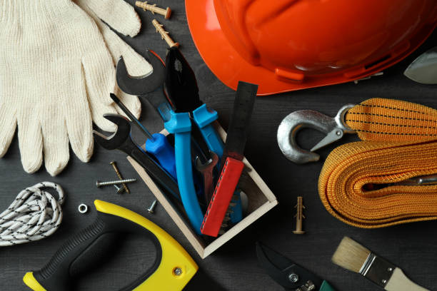istock Concept of Labor Day with different construction tools on dark wooden background 1310048789