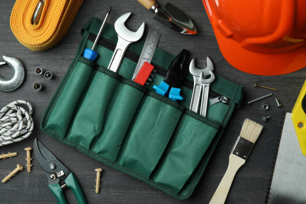 istock Concept of Labor Day with different construction tools on dark wooden background 1310048820