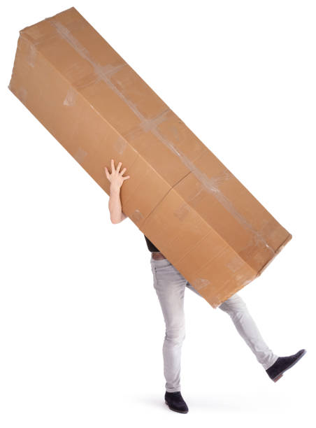 istock Man carrying a oversized cardboard box, isolated on white 1310049806