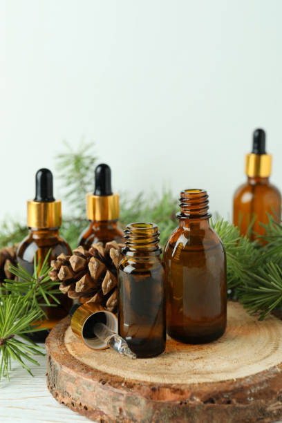 istock Aromatherapy concept with pine oil on white wooden table 1310050306