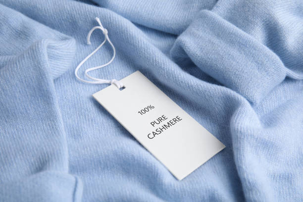 istock Warm light blue cashmere sweater with label, closeup 1310051203