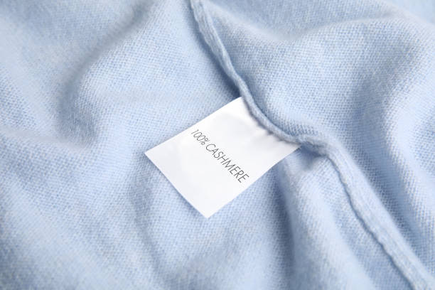 istock Warm light blue cashmere sweater with label, closeup 1310051211