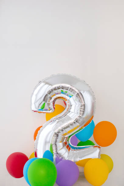 istock Number 2 two of color balloon on light background 1310051230