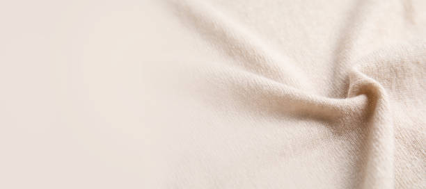 istock Warm cashmere fabric as background, closeup view with space for text. Banner design 1310051243