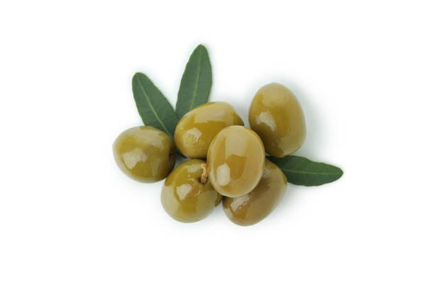 istock Tasty green olives isolated on white background 1310053271