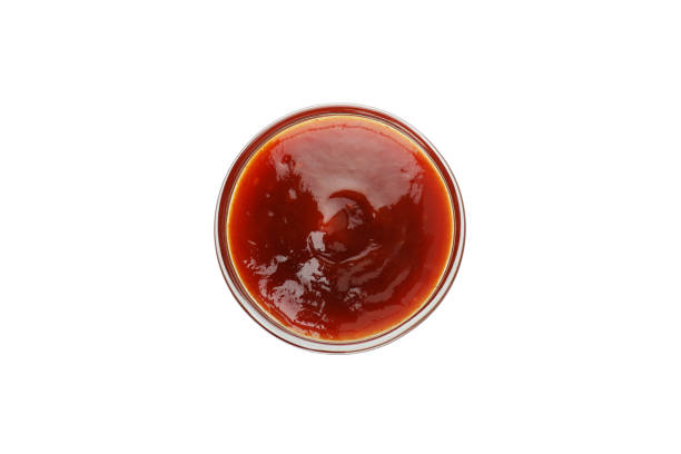 istock Bowl of barbecue sauce isolated on white background 1310054822