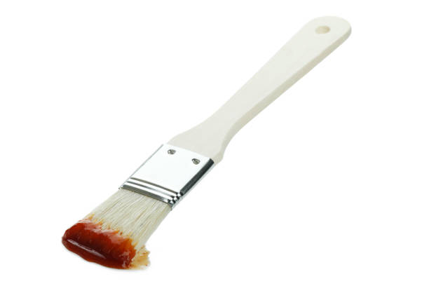 istock Brush with barbecue sauce isolated on white background 1310054828