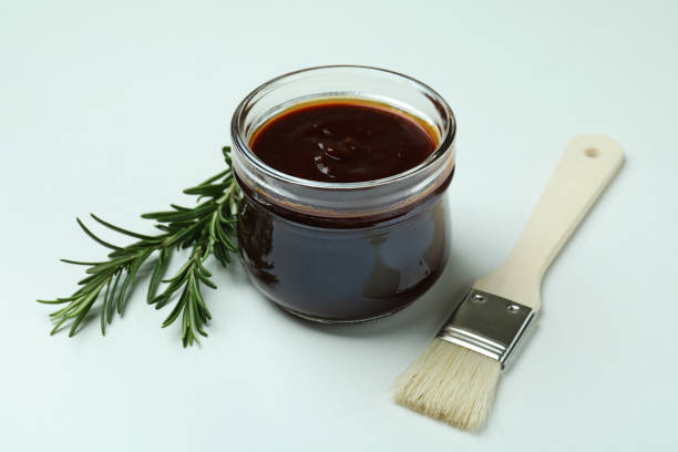istock Barbecue sauce, rosemary and brush on white background 1310054860