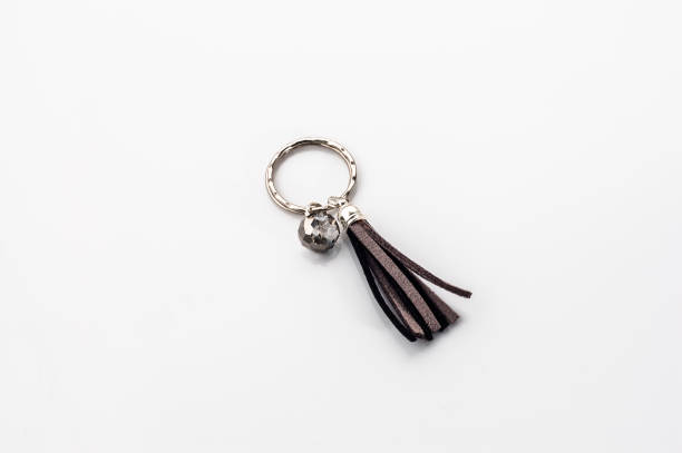 istock Fashionable key ring isolated on white, stylish boho jewelry 1310055011
