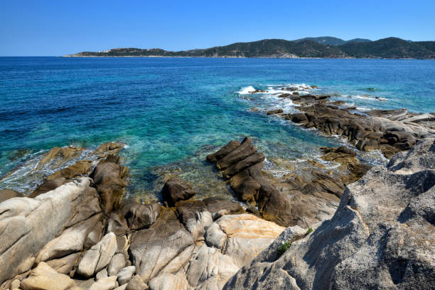 istock Beautiful seascape with stones and translucent blue water 1310056353
