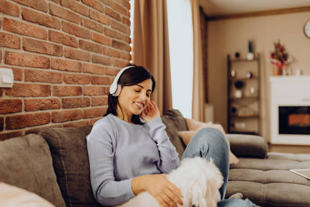 istock enjoy the afternoon on the sofa with my dog 1310056648
