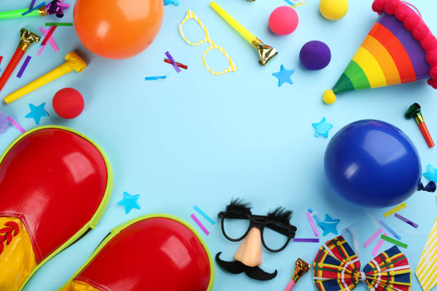 istock Clown accessories on light blue background, flat lay. Space for text 1310057678