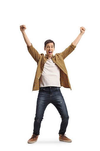 Full length portrait of an excited young man cheering with happiness isolated on white background