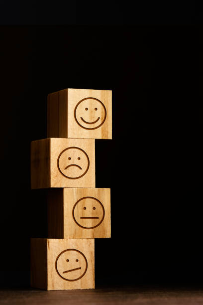 istock Smiley face symbols drawn on wooden blocks 1310059835