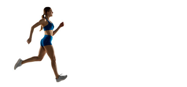 istock Young woman track athlete training isolated over white studio background. 1310060768