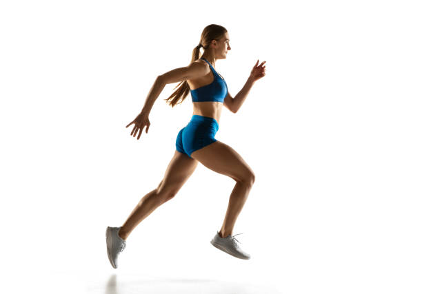 istock Beautiful woman, track athlete training isolated over white studio background. 1310060773