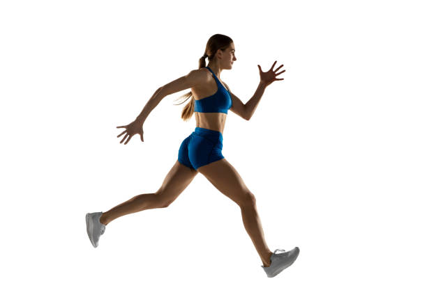istock Beautiful woman, track athlete training isolated over white studio background. 1310060775